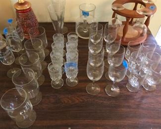 Assorted glassware from Pilsner to wine and a few cut sherry glasses.