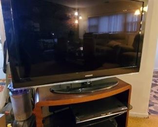 Another TV and tv stand, dvd player and vcr