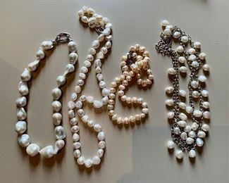 Pearl necklaces of various lengths with sterling silver clasps.
