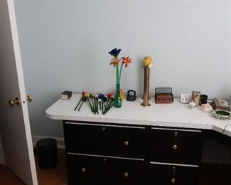 file  cabinets  with laminate  piece on top,  glass   flowers