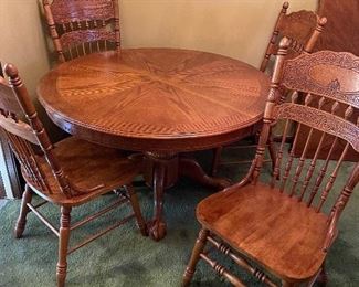 Oak pressed back chairs with oak table and leaf