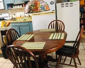 Kitchen table with chairs. Leaf is removable to make a round table