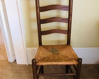 There are 4 ladder back rush bottom chairs.  There are 3 ladder back slat bottom chairs