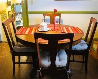 Oak pedestal table and chairs