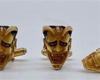 Lot 068
Pair of Carved Bone Devil Cuff Links and Tie Tack