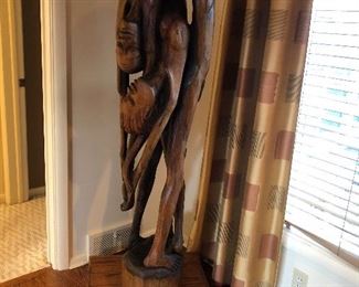 Life-size carved wood Haitian  sculpture
