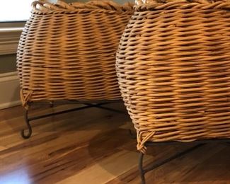 Pair of large baskets on iron stands 