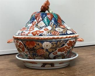 Reproduction hand painted Imari covered soup tureen with under plate. Perfect for a flower arrangement or orchid plant with the top tilted to the side 