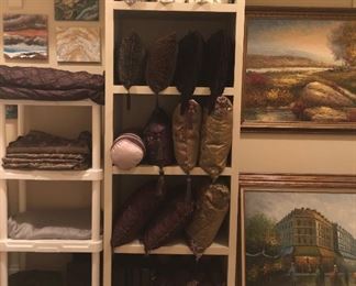Closet of home goods textiles, art, baskets