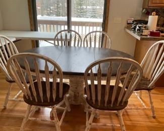 Six white- wash chairs,  42 inch round pedestal table with leaf 
