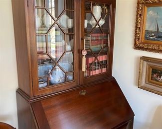 Mahogany secretary.  One piece.  Three shelves on top, desk and three drawers.