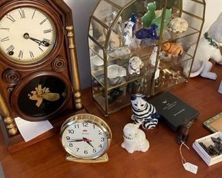 Collection of Franklin Mint cats in display, one of the antique clocks, Fenton cat