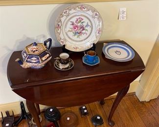 {pretty drop leaf table.  Nice porcelain and pottery pieces
