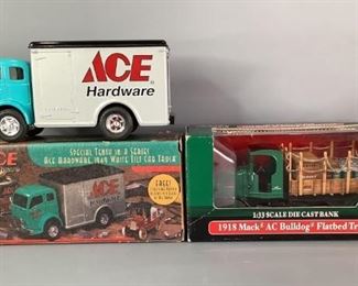 Ertl Collectibles Diecast Trucks
Two (2) Die-cast trucks; one is a 1918 Mack AC Bulldog Flatbed Truck and 1949 white tilt cab truck missing the 1/43 scale 1918 Ford runabout.