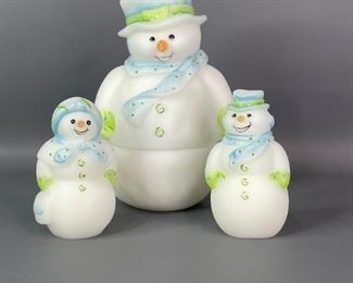 Fenton Snowmen
Matching three piece set of Fenton hand painted snowmen. One large 2-pc snowman,7.25"Hx5"W. Two smaller are male and female figurines, 4"Hx2.5"W. All are signed by S. Stephens. No visible cracks or chips.