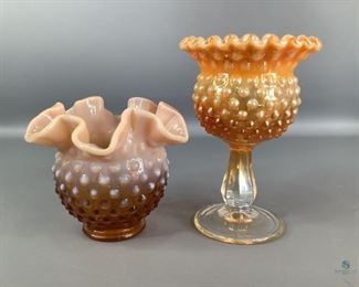 Fenton Hobnail Glass
One tan/brown hobnail with ruffle rimmed small bowl. 4.5"Hx5.25"W. No visible cracks or chips. One peach iridescent hobnail goblet with ruffled rim. 6.5"Hx4.25"W, no visible cracks or chips. Both are stamped Fenton on the bottom.