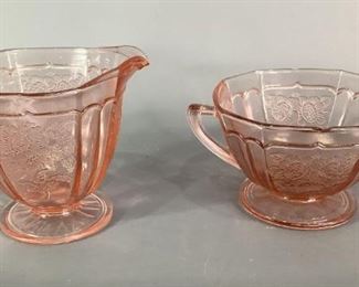 Pink Depression Glass
Pink Depression glass open sugar bowl with handles and creamer.