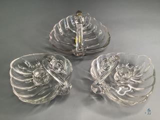 Duncan Miller Sylvan Swans
One is a Candy Dish and the other two are candle holders. Glass.