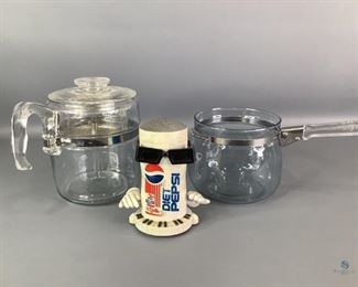 Pyrex Flameware Pots & Commercial Collectable
Includes a Pyrex Flameware Percolator w/ lid & basket, a Pyrex double boiler (missing lid), and a Ray Charles Pepsi Collectable.