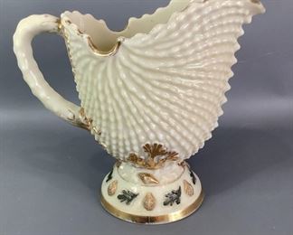 Vintage Pitcher
Northwood custard argonaut shell water pitcher believed to be form 1890s. Most of the gold has been lost to time there are no cracks or chips on the pitcher approx. 8" tall.