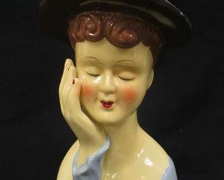 OLD PORCELAIN HEAD VASE. 6.5" TALL. SOME AREAS OF PAINT MISSING AROUND THE RIM OF THE HAT. THE HAT IS COLD PAINTED