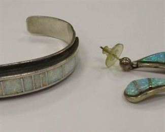 HAROLD SMITH - NAVAJO STERLING BRACELET INLAID WITH SECTIONS OF OPAL. A PAIR OF BENALLY STERLING EARRINGS SET WITH OPAL