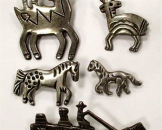 ALLISON MANUELITO NAVAJO STERLING PINS: a figurative collection - two goats, two horses and a horse drawn wagon . Each stamped 'AM'. Largest goat is 1.75" tall. 41.8 grams