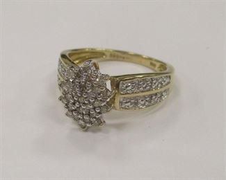 DIAMOND RING. A 14K YELLOW GOLD RING, SET WITH A CLUSTER OF SINGLE CUT DIAMONS. SHANK ACCENTED WITH WHITE GOLD. STAMPED WITH NV AND AN ILLEGIBLE MARK. SIZE 7. WIEGHT 3.3 GRAMS