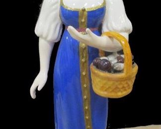 RUSSIAN PORCELAIN FIGURE OF A WOMAN WITH BASKET OF MUSHROOMS BY GARDNER PORCELAIN. Part of the Craftsmen & Trader series. SIGNED overglaze, marked 9. Factory 'G' under glaze. AS IS - the right crack under sleeve , paint added to basket. 8.5"