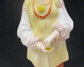 A RUSSIAN PORCELAIN FIGURE OF A UKRAINIAN WOMAN BY GARDner. IN THE STYLE OF THE "PEOPLE OF RUSSIA" SERIES. IMPRESSED MARK AND INK STAMPED. 8.25" TALL Condition: hands and ends of sleeves appear cold painted indicating some restoration-REBUILT