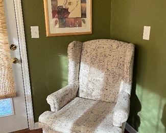 Wing back chair with French writing