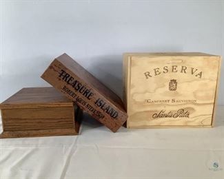 Decorative Boxes
One dark wood display stand, 5"Hx10"Wx10"D. One Hollow Treasure Island Book Box, 3.5"Hx 13"Wx 10"D. One Santa Rita Wine Box with sliding lid, 7.5"Hx13.5"Wx11"D. No visible damage.