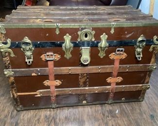 Old Trunk
Vintage steamer trunk. H24" x W36" x D21". NO key. Leather handles/straps broken. Interior paper in poor condition.