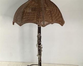 Clarinet Lamp
One wood and Normandy Clarinet handmade lamp with a wicker lamp shade and stone base. It powers on and is 36"Hx6"Wx6"D. No visible damage.