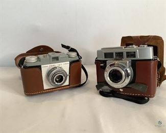 	
Vintage Kodak Cameras
One Kodak Pony 135 Camera with brown leather-like case. One Kodak Motormatic 35F camera in brown leather-like case. It has original instruction book. Black accent strip around lens is coming off. Unknown working condition of both cameras.