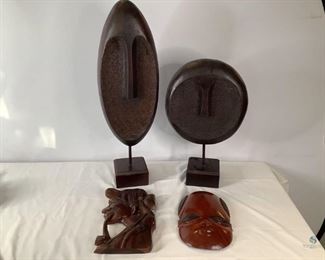 Modern Abstract Art Pieces
Two modern abstract face sculpture statues. One hand carved African themed mask and one tribal themed hear carving from the Philippines. Tallest one 30"H. No visible damage seen.