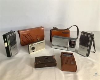 Transistor Radios and Cases
One Magnavox Eight transistor radio in brown case. One pair of Realtone 5 transistor transceivers in black and silver tone out cases. Model# 5151-A. One Realtone 10 transistor radio in black and silver tone outer case. Model#TR-1057. It has a small corner piece that is broken. One brown Toshiba leatherlike case. One brown leather like GE Seven Transistor radio case with carrying strap. One brown leather like Philco radio case with carrying strap. Unknown working condition of radios.