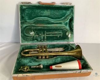 Besson Cornet
One Besson cornet made in England. Metal shows wear. Comes with case, mute, two mouthpieces,cleaning brush, and music clip. All pieces show wear.