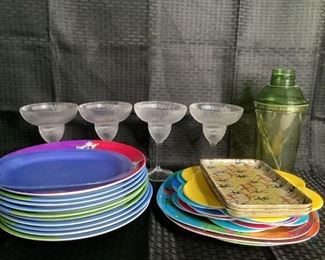 Outdoor Dinner and Drink Ware
Several colorful melamine/plastic plates. Also small snack trays. Four (4) plastic Margarita glasses and one green plastic drink shaker with stir sticks.