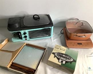 Retro Kitchen Appliances.
One red and silver tone ice bucket with lid. Two cut glass snack trays. Two small clear glass brandy sniffers. Four (4) small champagne glasses.