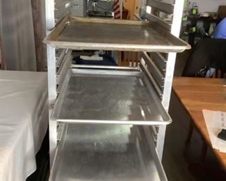 Stainless Steel Racks
Pair of industrial stainless steel shelf racks on wheels. Both comes with several stainless steel trays. 69"Hx21"Wx26"D. Both show signs of wear. Also includes large stainless steel 2-shelf unit. 35"Hx48"Wx25"D. Surface scuff marks/scratches are visible.