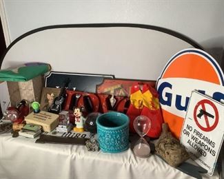 Fabulous Signs and More
Several items in this lot including a Gulf tin sign, vintage red with black handle battery operated hand held light., AshFlash red and white case with metal handle, foldable opera glasses, small metal wall art pieces and more!