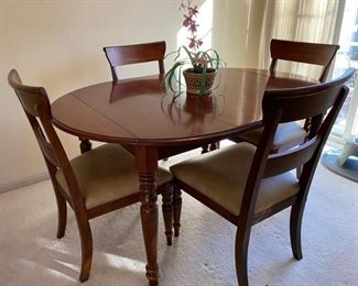 Ethan Allen British Classics - Drop Leaf Table with 4 Cinnabar Chairs -Few minor scratches on top of table. (new price was $1845 with original receipt in hand) 60"x 43" with both sides open 44"
