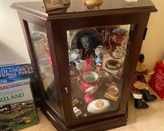 Small display cabinet full of Limoges Castel pieces