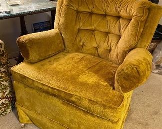 One of a pair of vintage gold armchairs