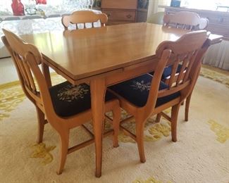 Dining table with pullout extensions and 4 chairs