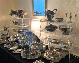 Numerous silverplate serving pieces