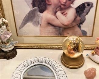 White wicker hand mirror; angel picture