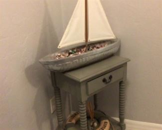 Small table (sold)with nautical decor  boat, life preserver & waste basket