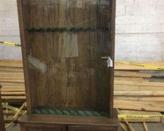 Gun cabinet with storage